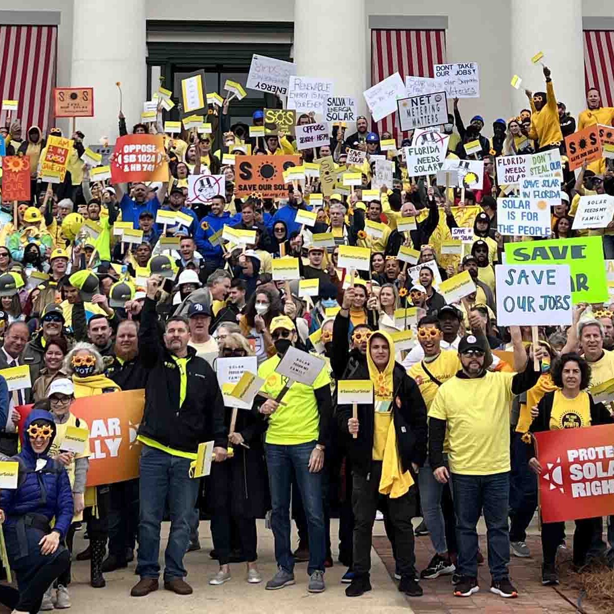 Rally in front of a Capitol building.