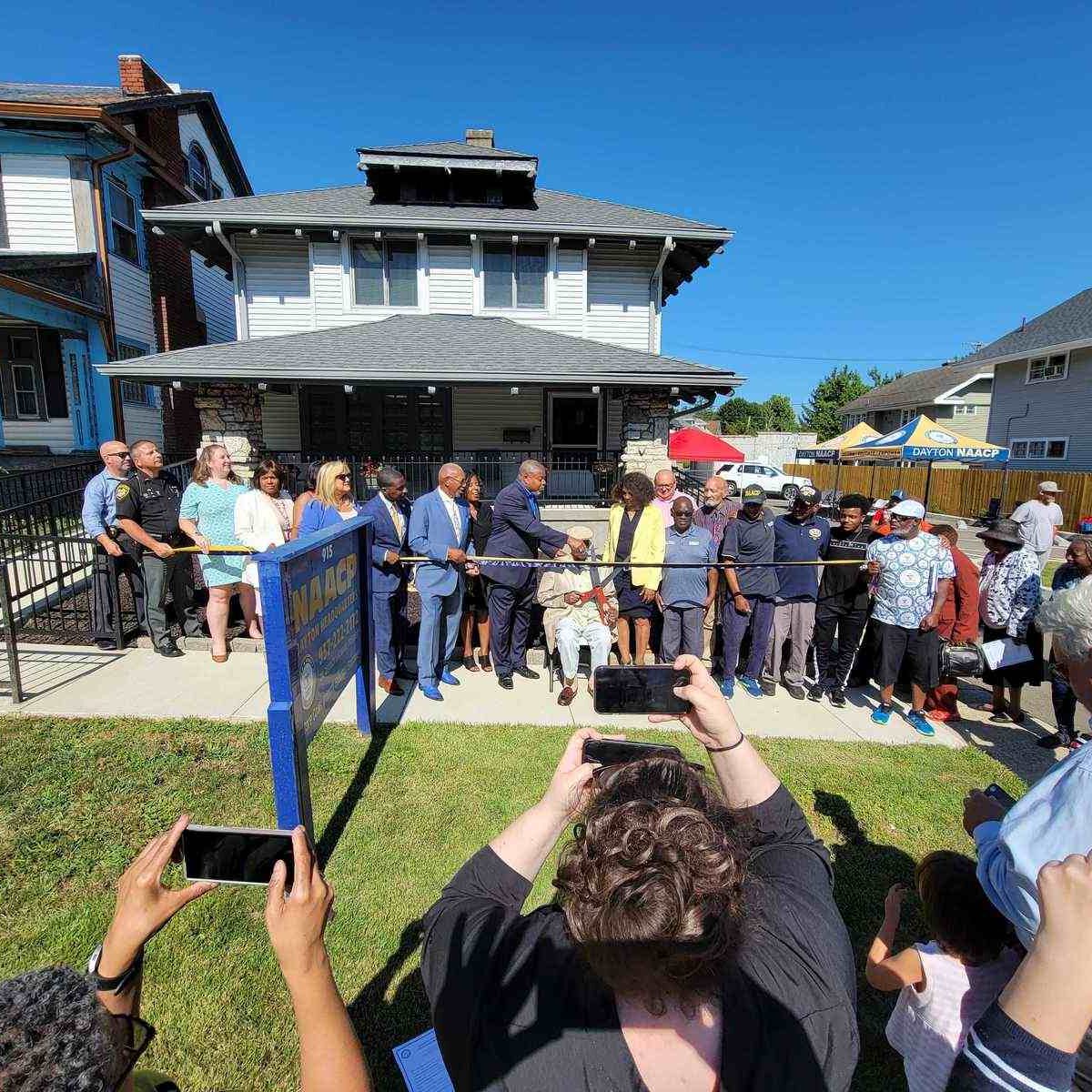 Group of people at Dayton NAACP headquarters for a press conference.