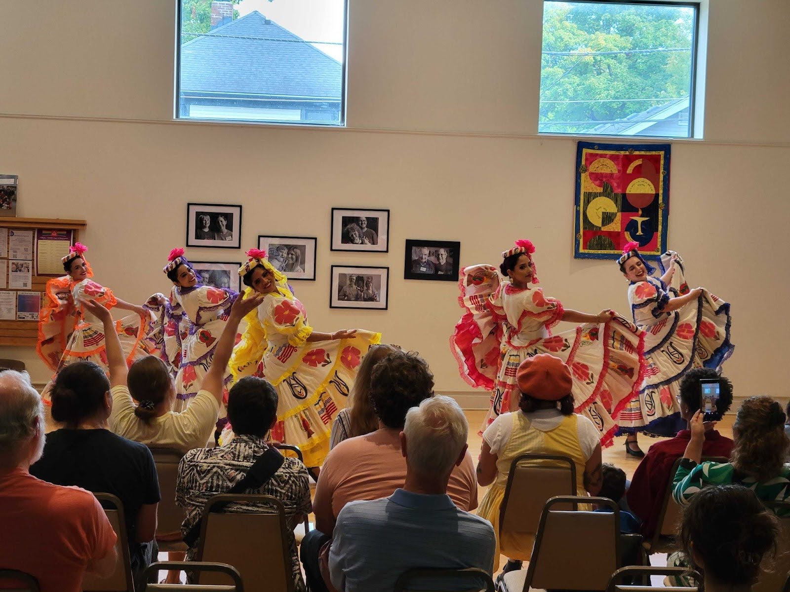 Women in dresses performing at Sun Day.