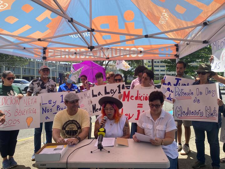 Solar supporters speaking at an advocacy event.