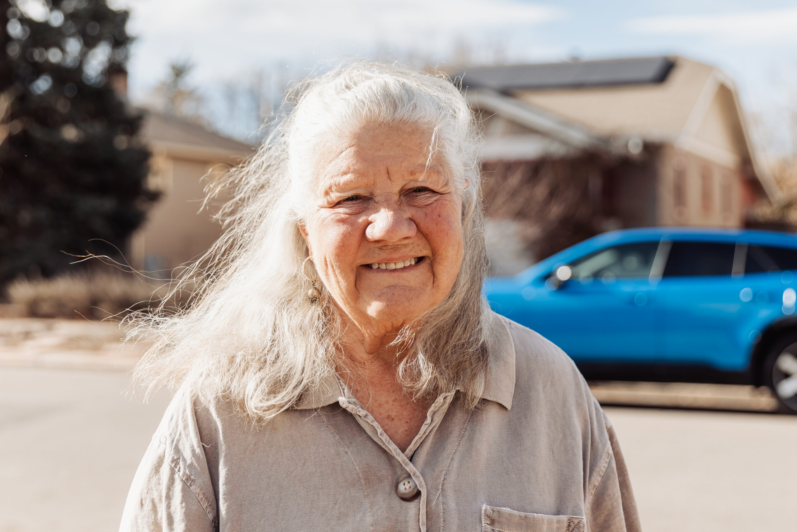 Shawna Crocker smiles in front of her solar home 